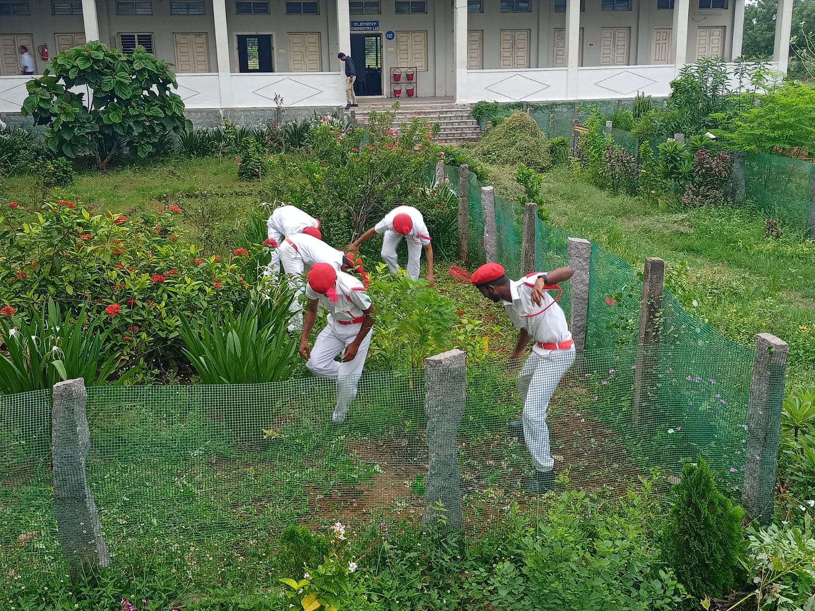 YOUTH RED CROSS VOLUNTEERS WORKING IN COLLEGE BUTTERFLY PARK AND HERBAL GARDEN