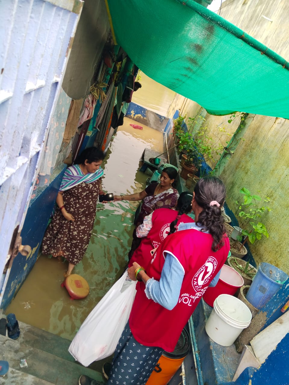 DISTRIBUTION OF FOOD AND HELPING FLOOD VICTIMS IN VIJAYAWADA